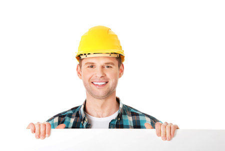 Happy worker presenting empty banner ad.