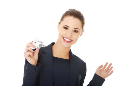 Young businesswoman with plane toy in handの写真素材