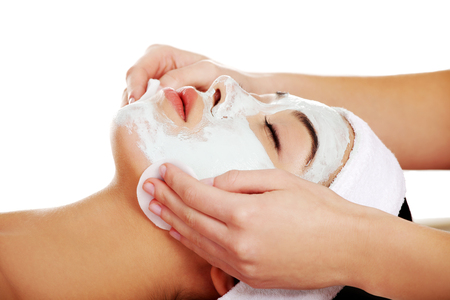 Relaxed woman with  a deep cleansing nourishing face mask applied to her face, beauty and skincare conceptの写真素材