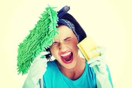 Tired frustrated and exhausted cleaning woman screaming , isolated on white