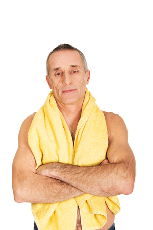 Mature man holding towel around neck.の写真素材