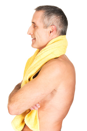 Side view mature man holding towel around neck.の写真素材