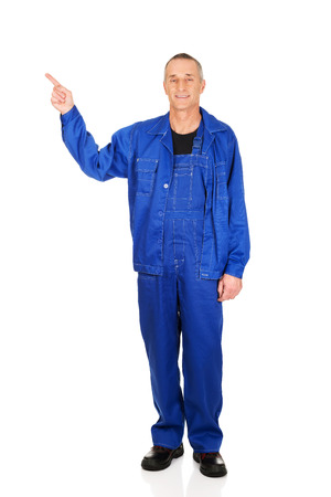 Full length repairman pointing up.の写真素材