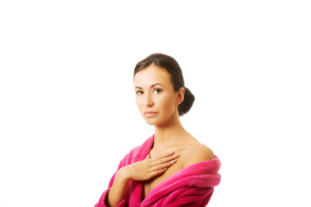 Portrait of a woman wearing pink bathrobe.の写真素材