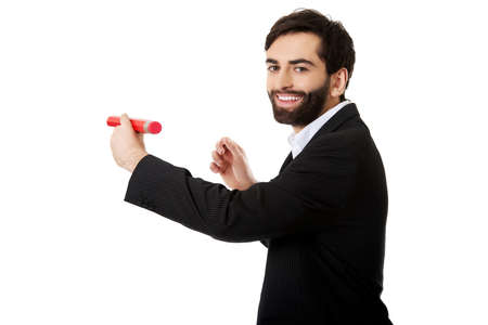 Handsome businessman writing with big red pencil.の写真素材