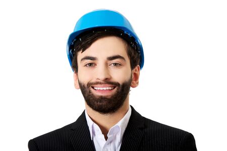 Smiling handsome businessman with hard hat.の写真素材