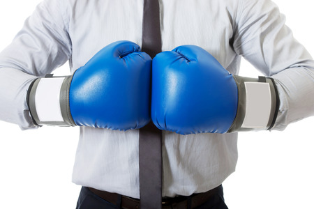 Young businessman with boxing gloves.の写真素材