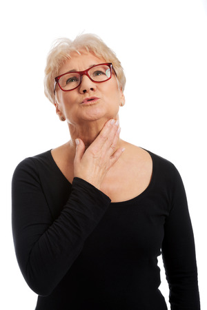 Senior woman suffering from throat painの写真素材