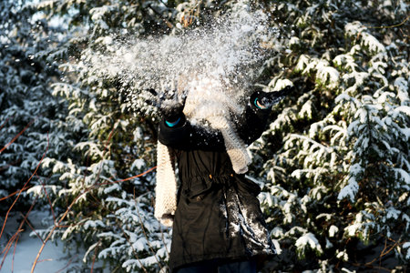 Teenage woman is defending herself from snowball