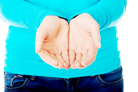 Close up on woman cupped hands.の写真素材