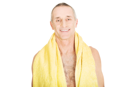Smiling mature man with a towel around neck.の写真素材