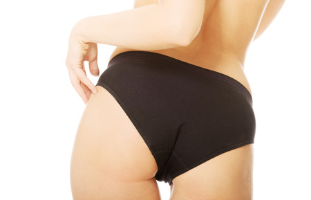 Woman slim bum in black pantiesの写真素材
