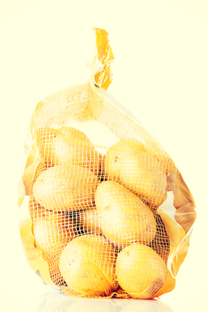 Fresh potatoes in a sack.の写真素材