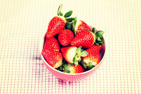 Fresh red strawberries in a bowl.の写真素材