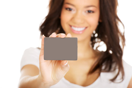 Happy african woman holding a card.の写真素材