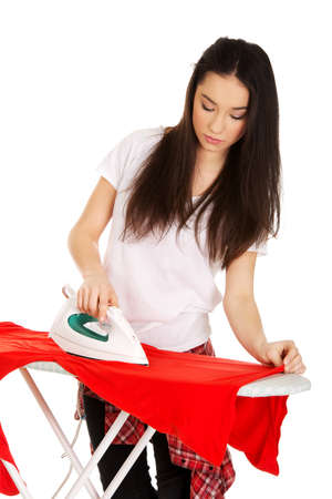 Young beautiful woman do the ironing.の写真素材