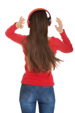 Young woman with headphones listening music.の写真素材