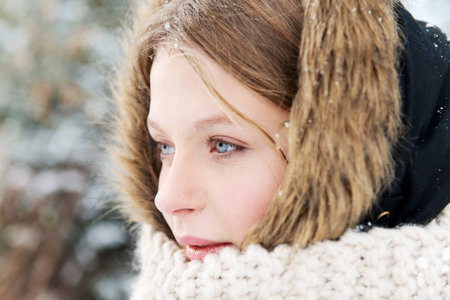 Teenage woman in winter clothes outdoor