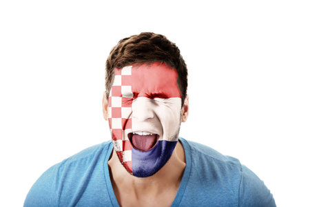 Screaming man with Croatia flag painted on face.の写真素材