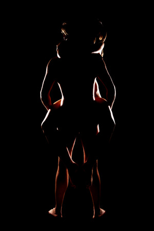 Young naked man carrying nude woman.の写真素材