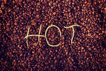 Hot inscription on many coffee beansの写真素材