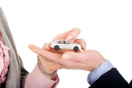 Caucasian businesswoman giving small car to her partner.の写真素材