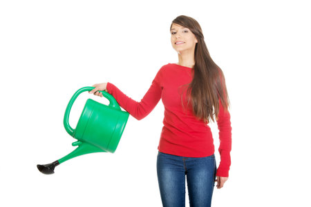 Happy woman holding a watering can.の写真素材