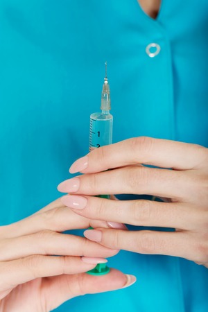 Female nurse hands with a syringe.の写真素材