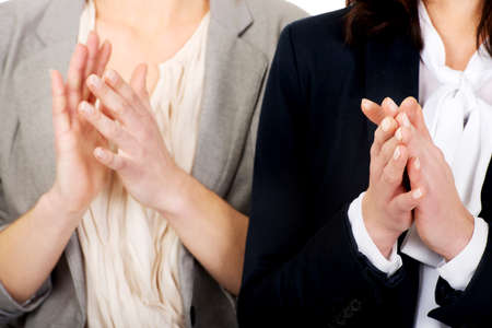Two happy cheerful businesswomen applauding.の写真素材