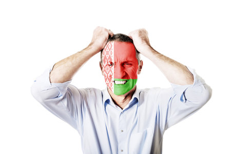 Angry mature man with Bealrus flag painted on face.の写真素材