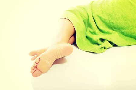 Female legs wrapped in towel.の写真素材