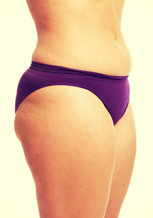 Womans fat belly in underwear.の写真素材