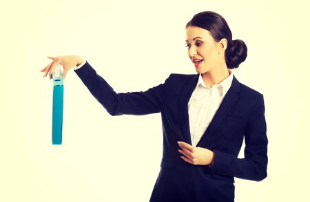 Businesswoman pretending to drop a binder.の写真素材