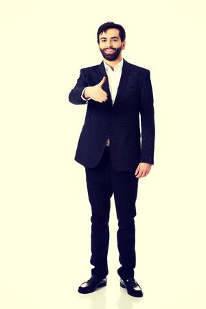Young happy businessman offering a handshake.の写真素材