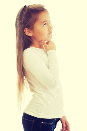 Little girl thinking about something interestingの写真素材