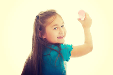 Little pretty girl with a big crayonの写真素材