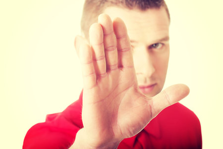 Handsome man pressing an abstract touchscreen buttonの写真素材