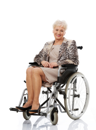 Smiling old woman in her wheelchairの写真素材
