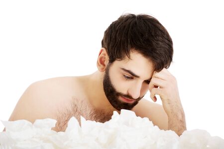 Sick man with a lot of tissues.の写真素材