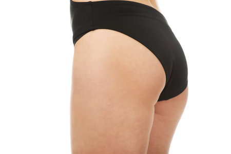 Sexy young woman back in panties.