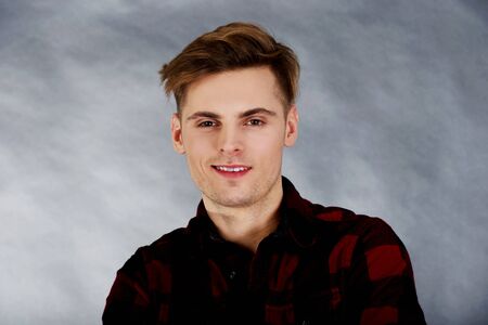 Young handsome man smiling to camera.の写真素材