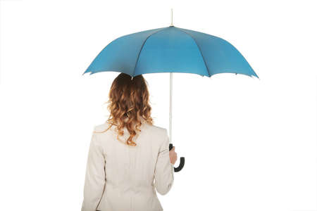 Attractive businesswoman holding an umbrella.の写真素材