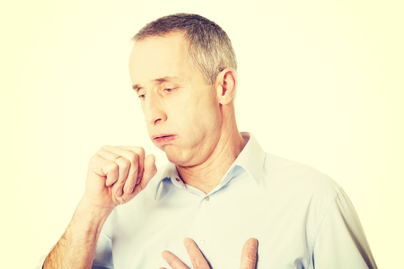 Mature man coughing because of flu.の写真素材