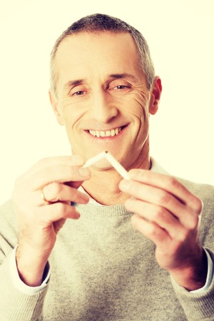 Successful mature man quits smokingの写真素材