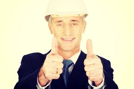 Mature engineer businessman showing ok sign.の写真素材