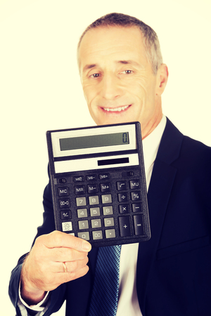 Happy businessman holding a calculator.の写真素材