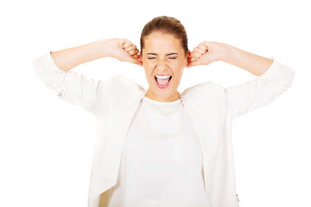 Young angry businesswoman- screaming and pull hair out.の写真素材