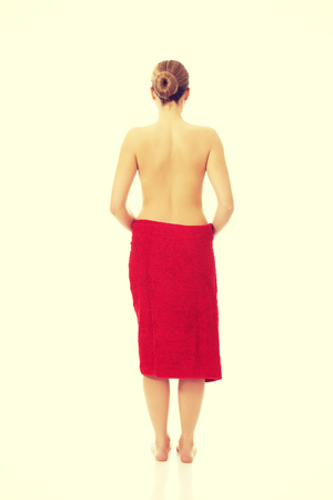 Beautiful topless woman wrapped in towel.の写真素材