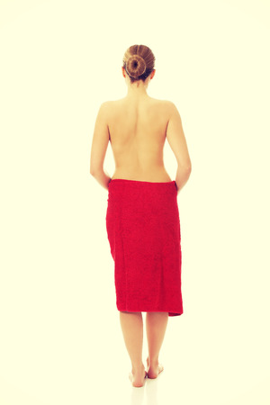 Beautiful topless woman wrapped in towel.の写真素材