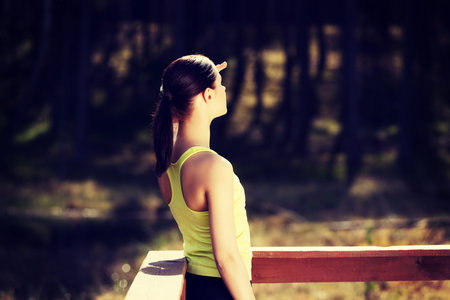 Beautiful woman relaxing after runningの写真素材